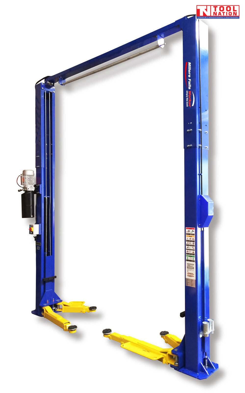 Blue two-post vehicle lift with yellow lifting arms and an overhead crossbeam.