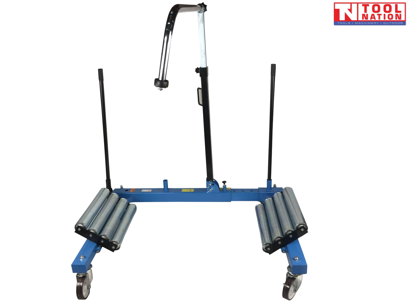 Front view of blue tractor wheel dolly with twin roller platforms, caster wheels, and central support arm