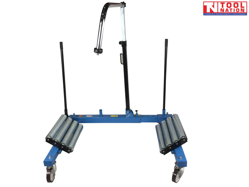 Front view of blue tractor wheel dolly with twin roller platforms, caster wheels, and central support arm