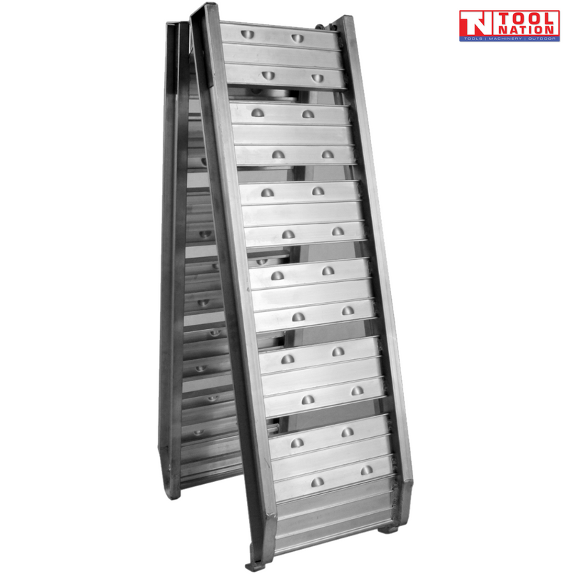 Folded aluminium loading ramp standing open in A-frame position on a light grey background