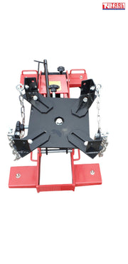Top front view of red floor transmission trolley jack with black saddle plate, corner brackets, and safety chains