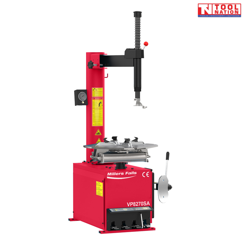 Red semi-automatic tyre changer with swing arm, turntable clamps, pressure gauge and side lever, shown from the front.