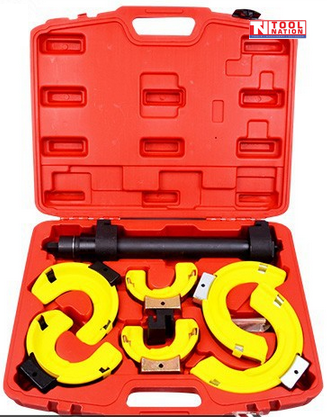 MacPherson strut spring compressor kit in red case with interchangeable jaws for automotive suspension repair