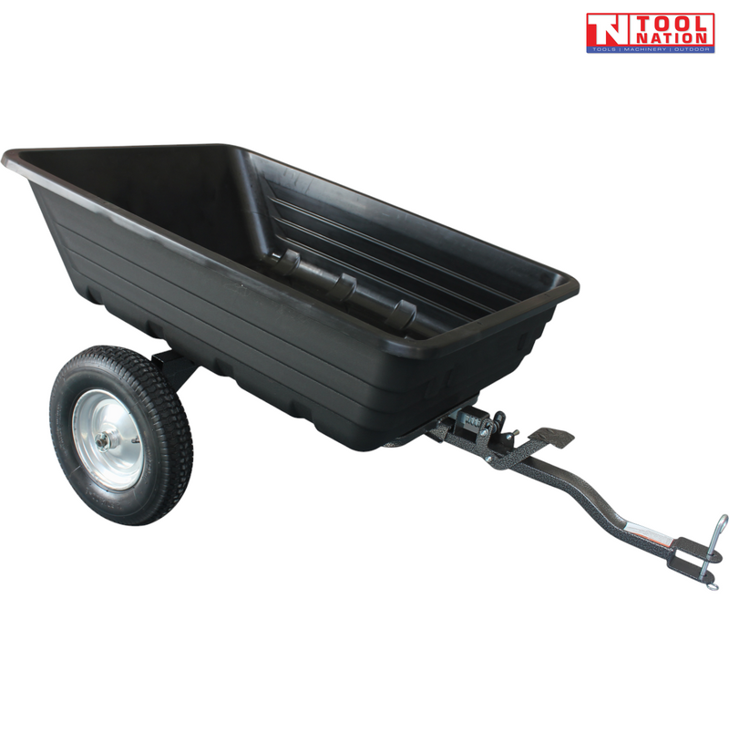 Black tow-behind dump cart shown from above with an open tub, long drawbar, metal pin, two treaded wheels and Tool Nation logo.