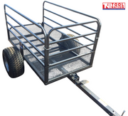 Black mesh-sided trailer shown from the rear side with a long drawbar, side rails, mesh panels, two treaded tyres and Tool Nation logo.