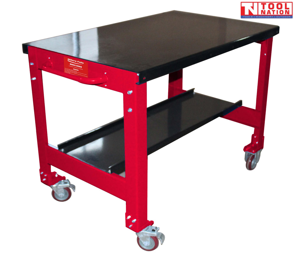 Angled front view of red mobile workbench with black top, lower shelf, and castor wheels