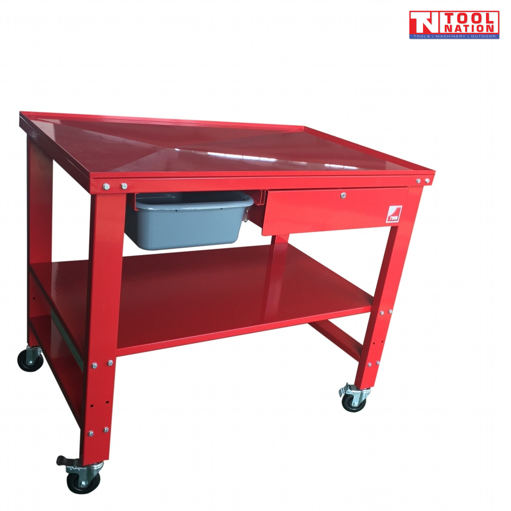 Angled front view of red mobile workbench with top tray, lower shelf, drawer, and castor wheels