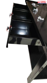 Side close-up of black steel workbench showing side panel and drawer unit.