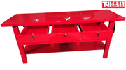 Front angled view of red steel workbench with all three drawers open.