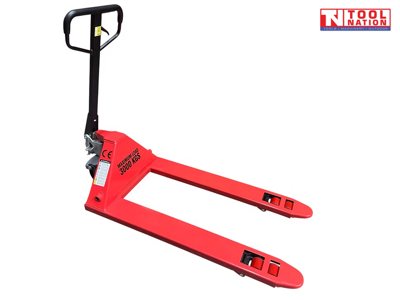 Red pallet truck with black handle, twin forks, front rollers, warning labels, and a logo in the top right corner.