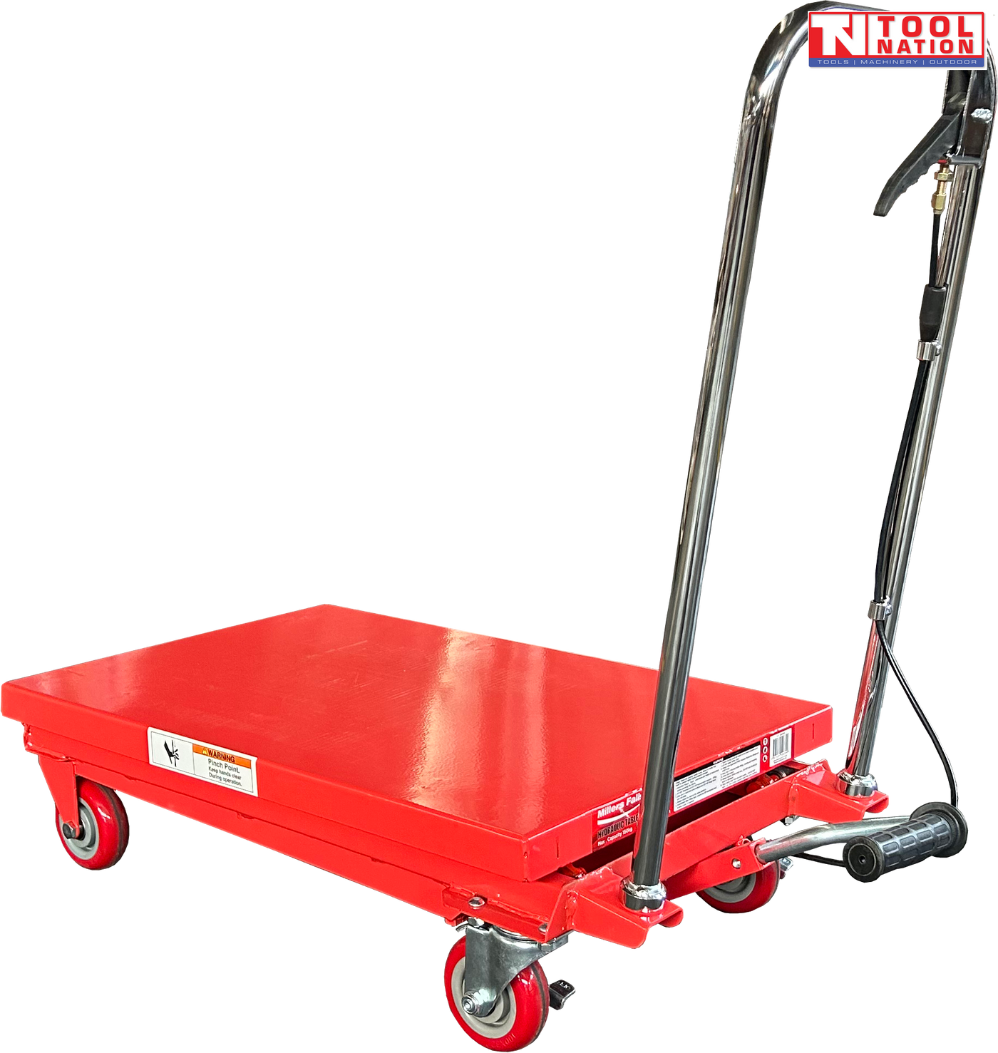 Red hydraulic lift table cart with lowered platform, chrome handle, wheels, and warning labels.