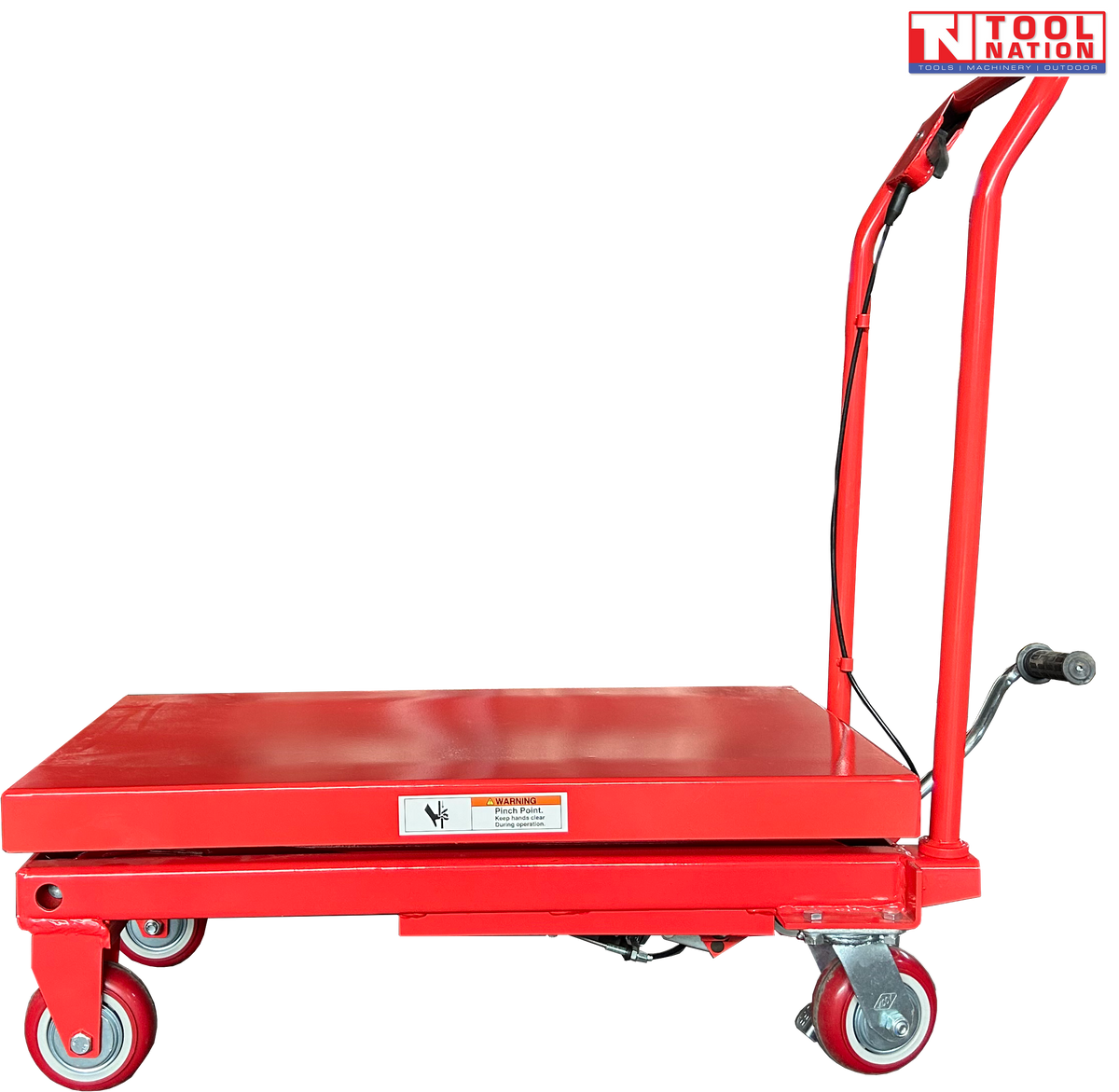 Side view of a red hydraulic lift table cart with lowered platform, handle, wheels, foot pedal, and warning label.