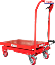 Angled view of a red hydraulic lift table cart with lowered platform, handle, wheels, foot pedal, and labels.
