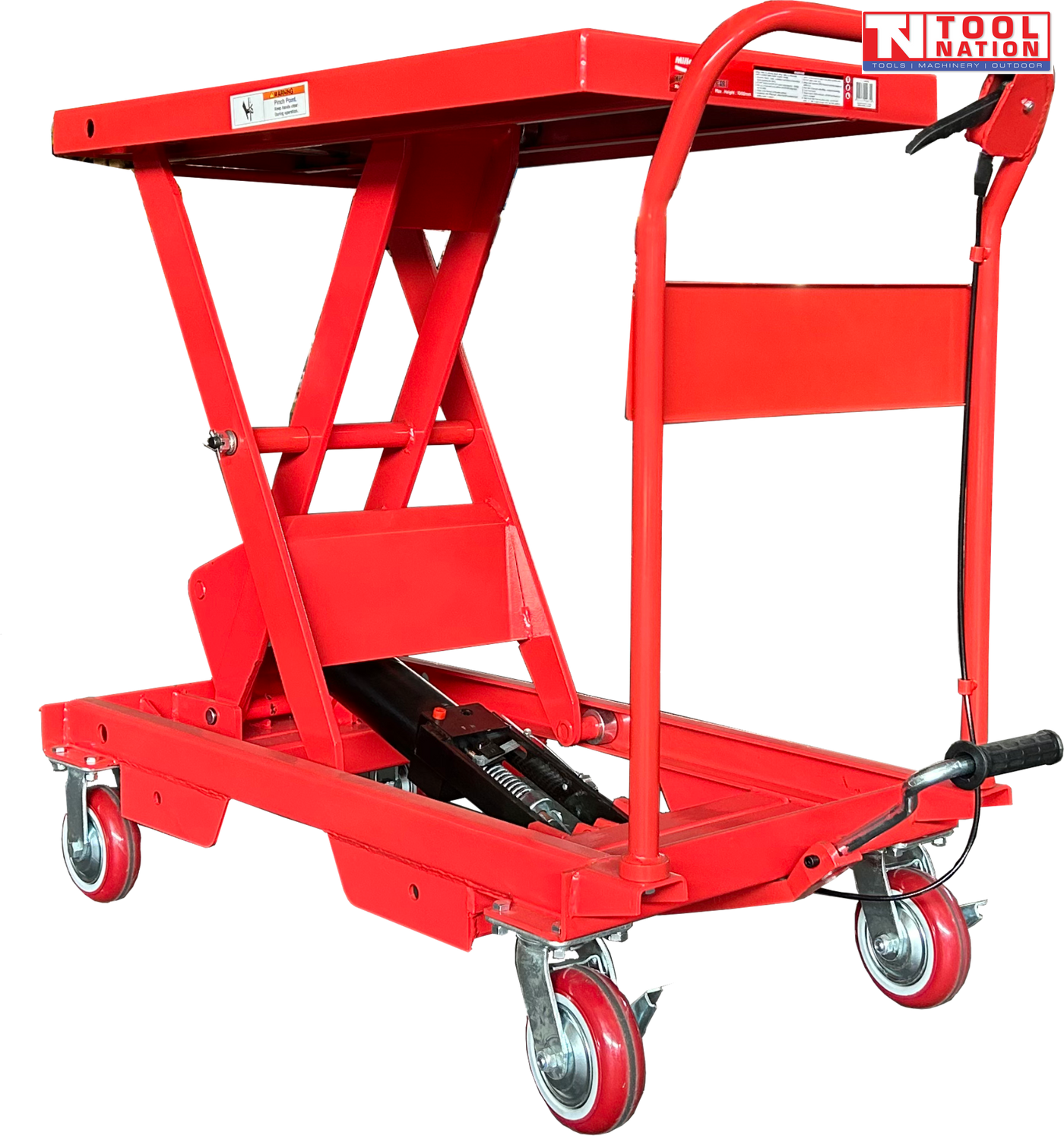 Angled view of a red hydraulic lift table cart with raised scissor frame, handle, wheels, foot pedal, and warning labels.