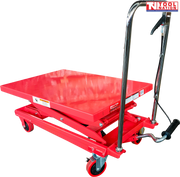 Red hydraulic lift table cart with lowered platform, chrome handle, foot pedal, wheels, and labels.