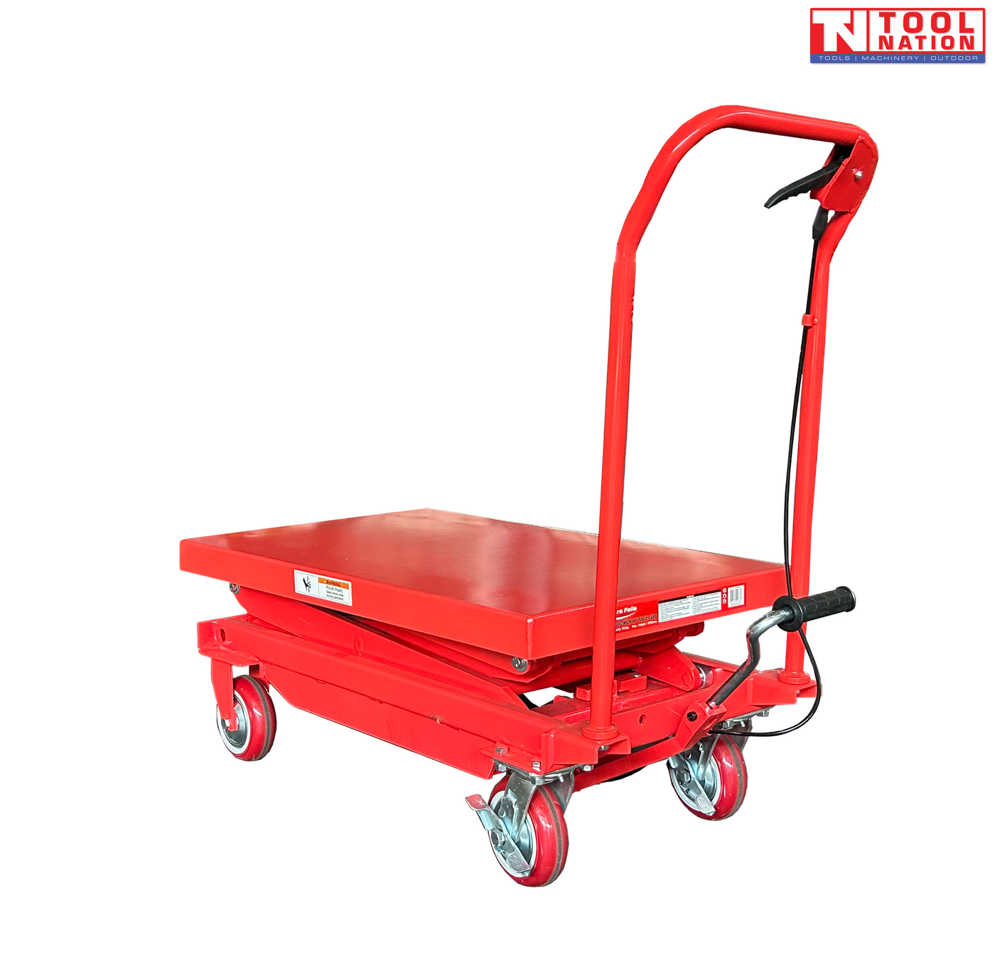 Red hydraulic lift table cart with lowered platform, handle, wheels, foot pedal, labels, and logo in the top corner.