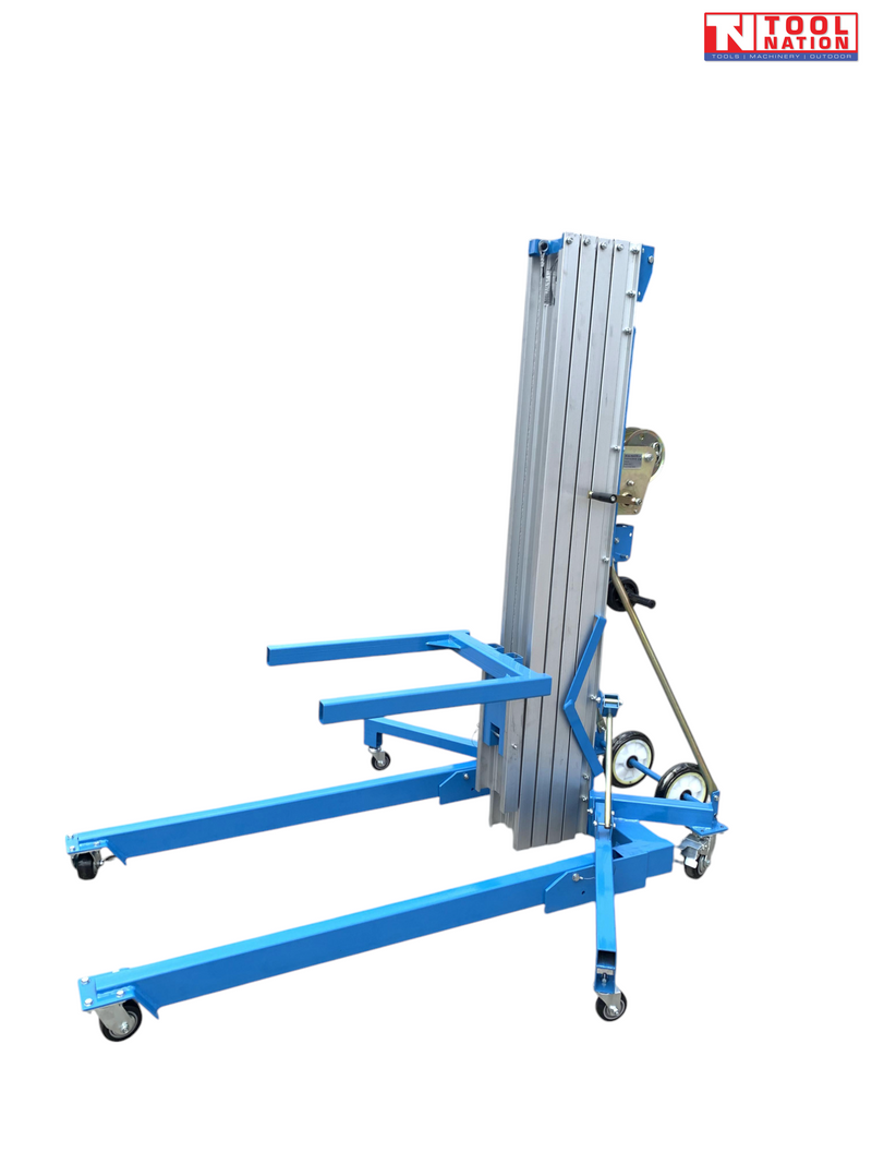 Blue material lift with forks, mast, hand crank, stabiliser legs, caster wheels, and logo in the top corner.