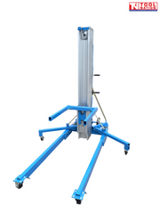 Front view of a blue material lift with forks, tall mast, stabiliser legs, caster wheels, hand crank, and logo in the top corner.