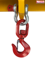 Close-up of a red swivel hook and silver shackle attached beneath a yellow forklift lifting hook frame.