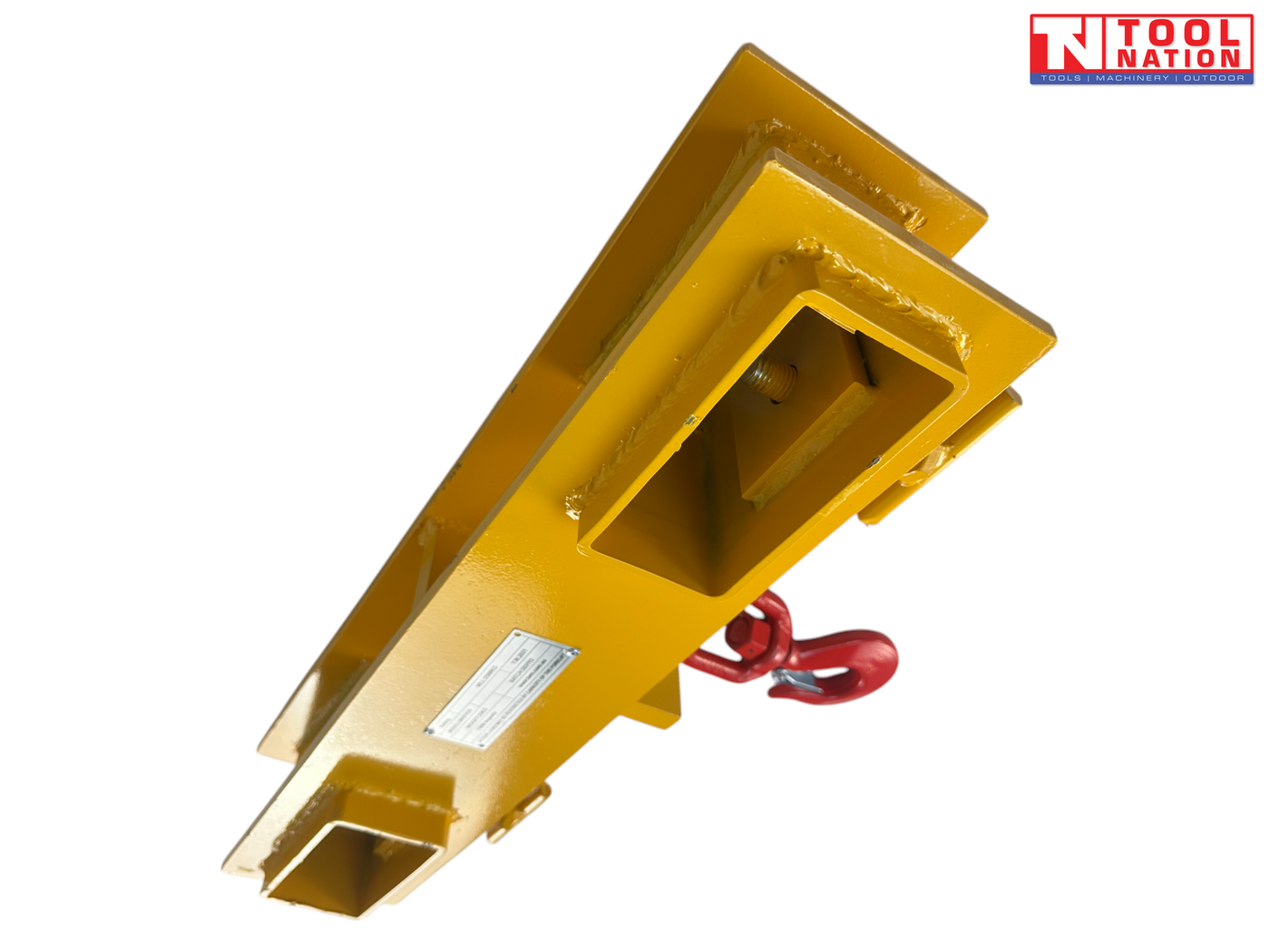 Underside angle of a yellow forklift lifting hook attachment showing rectangular fork pockets, clamp screws, label plate and partly visible red hook.
