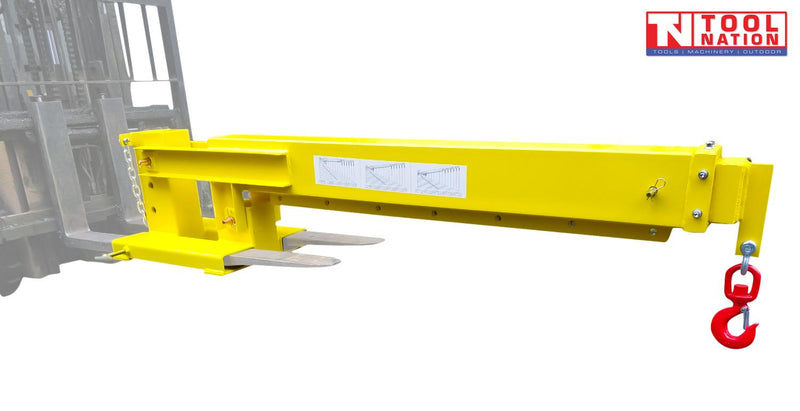 Yellow forklift crane jib attached to forklift tines, with a long boom, red swivel hook, chain, warning labels and Tool Nation logo.