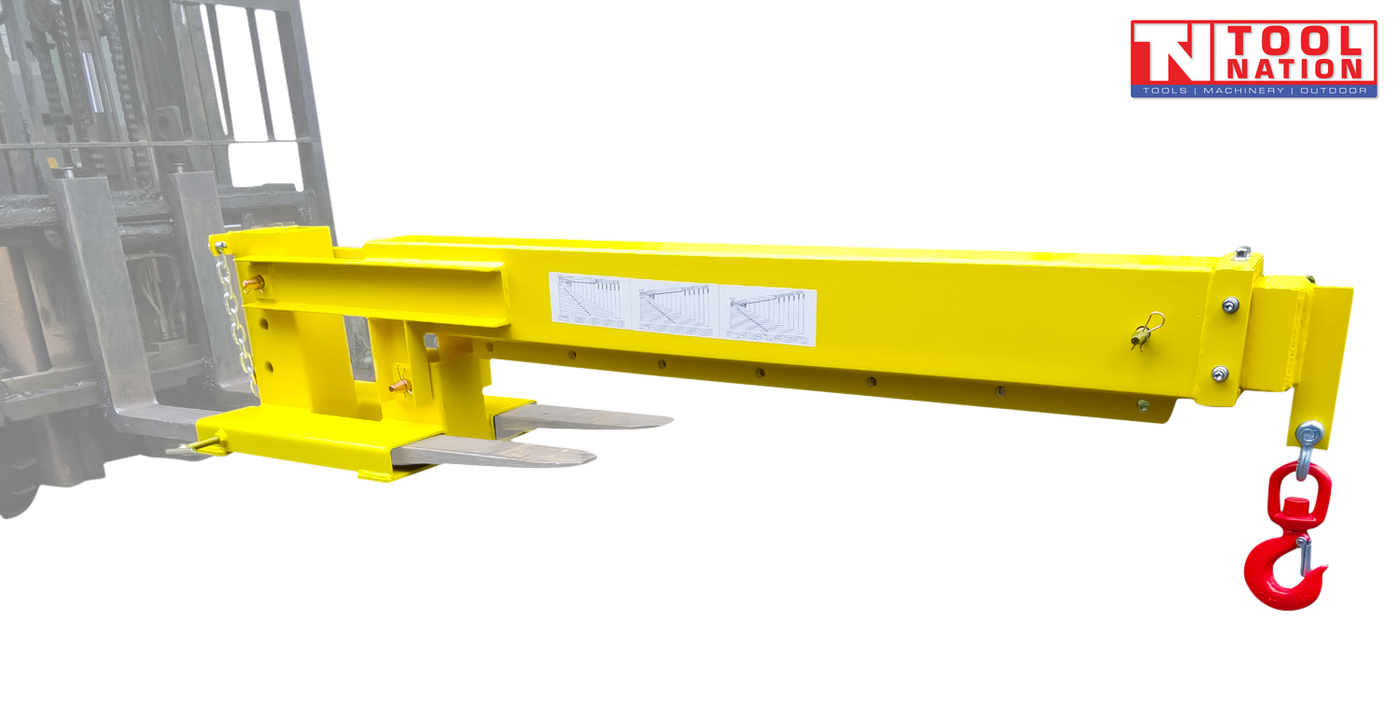 Yellow forklift crane jib attached to forklift tines, with a long boom, red swivel hook, chain, warning labels and Tool Nation logo on a dark background.