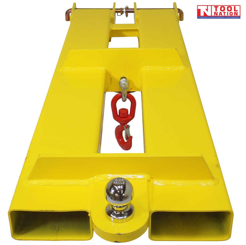Yellow forklift tow jib attachment shown from above with two fork pockets, red swivel hook, silver shackle, tow ball and Tool Nation logo.