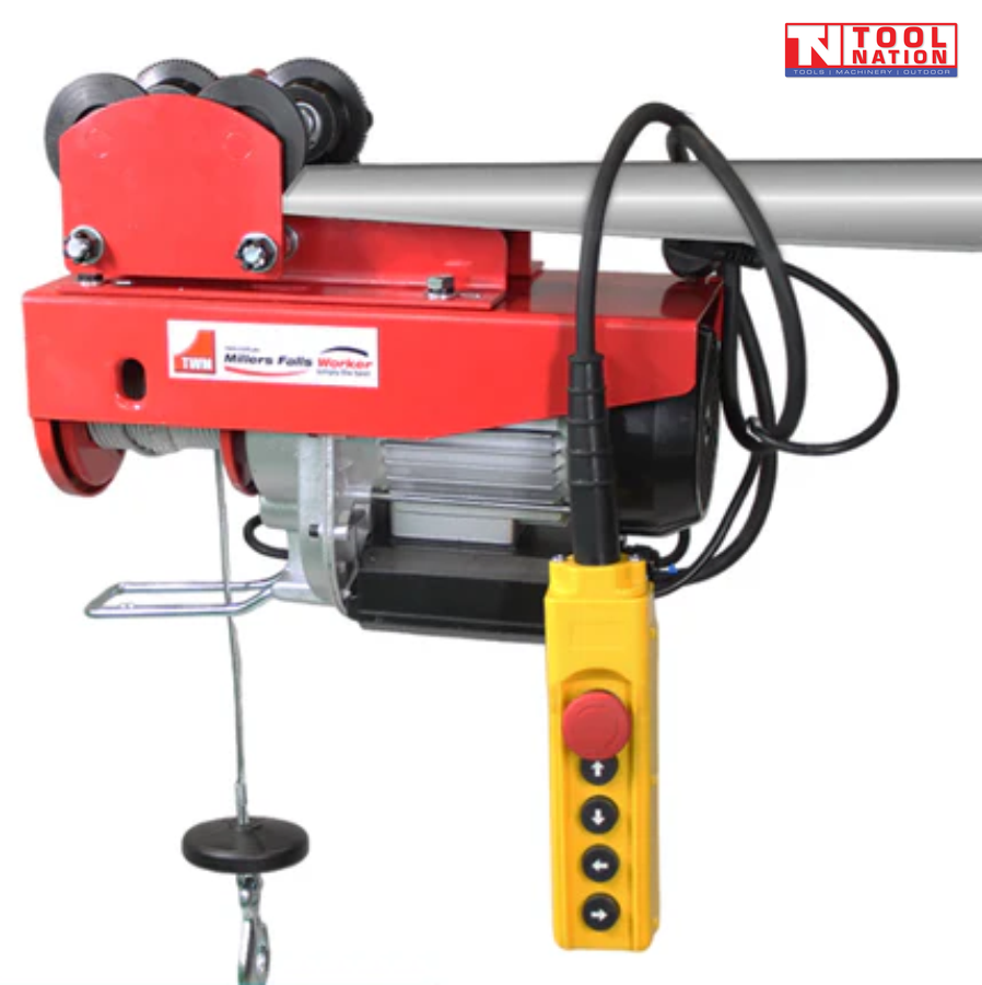 Red electric hoist mounted on a beam with trolley wheels, hanging hook, and yellow pendant control.